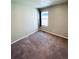 Spacious carpeted bedroom with a window at 19085 E 66Th Ave, Denver, CO 80249