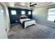 Spacious bedroom with blue accent wall and a queen-size bed at 19085 E 66Th Ave, Denver, CO 80249