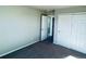 Well-lit bedroom with double door closet and carpet flooring at 19085 E 66Th Ave, Denver, CO 80249