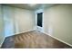 Simple bedroom with window, curtain, and carpet flooring at 19085 E 66Th Ave, Denver, CO 80249