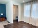 Bright entryway with wood flooring and built-in bench at 19085 E 66Th Ave, Denver, CO 80249