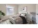 Charming bedroom with a queen bed and stylish decor at 149 Poplar St, Lochbuie, CO 80603