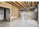 Unfinished basement area with partial framing and flooring at 320 Mayeda St, Brighton, CO 80601