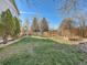 Spacious backyard with grassy area and wooden fence at 6579 Poppy St, Arvada, CO 80007