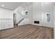 Bright living room with high ceilings, hardwood floors, and a modern fireplace at 8812 Whiteclover St, Littleton, CO 80125