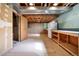 Unfinished basement with built-in shelving and workbench at 11008 Vrain Ct, Westminster, CO 80031