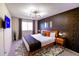 King-size bed in a stylish main bedroom with dark-toned decor at 11008 Vrain Ct, Westminster, CO 80031