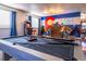 Pool table in a game room with a Colorado mural and bar area at 11008 Vrain Ct, Westminster, CO 80031