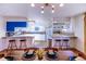 Bright kitchen with white cabinets, breakfast bar, and dining area at 11008 Vrain Ct, Westminster, CO 80031
