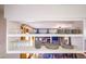 Open shelving with dishes and glassware above kitchen counter at 11008 Vrain Ct, Westminster, CO 80031