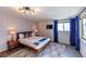 Bedroom with king-size bed and mid-century modern decor at 11008 Vrain Ct, Westminster, CO 80031