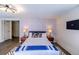 Main bedroom with king-size bed and mid-century modern decor at 11008 Vrain Ct, Westminster, CO 80031