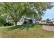 Two-story house with brick and siding, landscaped yard, and large tree at 11008 Vrain Ct, Westminster, CO 80031