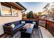 Relaxing deck with sectional sofa and fire pit, perfect for outdoor entertaining at 11008 Vrain Ct, Westminster, CO 80031