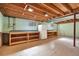 Unfinished basement with built-in shelving and workbench at 11008 Vrain Ct, Westminster, CO 80031