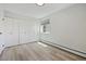 Bedroom with double closet and wood-look floors at 9315 E Center Ave # 11A, Denver, CO 80247