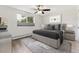 Main bedroom with a queen bed, nightstands, and a ceiling fan at 9315 E Center Ave # 11A, Denver, CO 80247