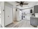 Modern kitchen with gray cabinets and white appliances at 9315 E Center Ave # 11A, Denver, CO 80247