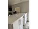 Kitchen island with white countertops and ample storage space at 493 N 48Th Ave, Brighton, CO 80601