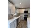 White kitchen featuring stainless steel appliances, white countertops, and ample cabinet space at 493 N 48Th Ave, Brighton, CO 80601