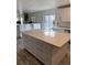 Bright kitchen with white cabinets, large island, and modern appliances at 493 N 48Th Ave, Brighton, CO 80601