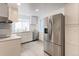 Modern kitchen featuring white cabinetry and stainless steel appliances at 493 N 48Th Ave, Brighton, CO 80601