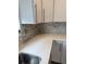 Modern kitchen features white shaker cabinets, sleek countertops, and stylish backsplash at 493 N 48Th Ave, Brighton, CO 80601