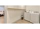 Laundry room with white cabinets, washer, and dryer at 493 N 48Th Ave, Brighton, CO 80601