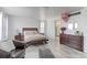 Primary bedroom with en-suite bathroom, ample space, and natural light at 493 N 48Th Ave, Brighton, CO 80601