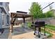 Concrete patio area with gazebo, grill, and seating at 493 N 48Th Ave, Brighton, CO 80601