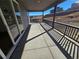 Covered patio with concrete flooring, railings, and views of the backyard at 1658 Fox Trotter Pt, Castle Rock, CO 80104