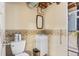 Clean basement bathroom with toilet, sink, and tiled walls at 746 Bow Mountain Rd, Boulder, CO 80304