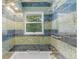 Updated bathroom with a tiled shower and tub at 746 Bow Mountain Rd, Boulder, CO 80304