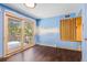 Cozy office space with wood paneled walls and sliding doors at 746 Bow Mountain Rd, Boulder, CO 80304