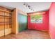 Bedroom with wood paneling, built in shelving and green closet doors at 746 Bow Mountain Rd, Boulder, CO 80304