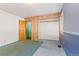 Bedroom with wood-paneled closet and carpeting at 746 Bow Mountain Rd, Boulder, CO 80304