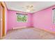 Pink bedroom with carpeted floors and ceiling fan at 746 Bow Mountain Rd, Boulder, CO 80304