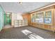 Spacious living room with built-in shelving and large windows at 746 Bow Mountain Rd, Boulder, CO 80304