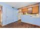 Galley kitchen with wood cabinets and a breakfast bar at 746 Bow Mountain Rd, Boulder, CO 80304