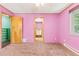 Pink bedroom with carpet and access to bathroom at 746 Bow Mountain Rd, Boulder, CO 80304