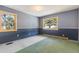Simple bedroom with carpeting, two windows, and neutral walls at 746 Bow Mountain Rd, Boulder, CO 80304