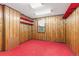 Basement room with wood paneling and red carpet at 746 Bow Mountain Rd, Boulder, CO 80304
