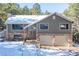 Two-story house with double garage and snowy landscaping at 746 Bow Mountain Rd, Boulder, CO 80304