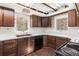 Kitchen features wood cabinets and a double sink at 746 Bow Mountain Rd, Boulder, CO 80304
