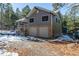 Two-story house with double garage and snowy landscaping at 746 Bow Mountain Rd, Boulder, CO 80304