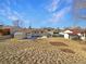 Large backyard with storage shed and a view of the house's back elevation at 762 S Simms St, Lakewood, CO 80228