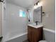 Updated bathroom with a tub and modern vanity at 762 S Simms St, Lakewood, CO 80228