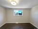 Spacious bedroom with dark hardwood floors and neutral walls at 762 S Simms St, Lakewood, CO 80228