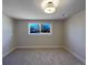 Spacious bedroom with neutral walls and new carpet at 762 S Simms St, Lakewood, CO 80228