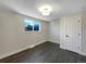 Well-lit bedroom featuring hardwood floors at 762 S Simms St, Lakewood, CO 80228